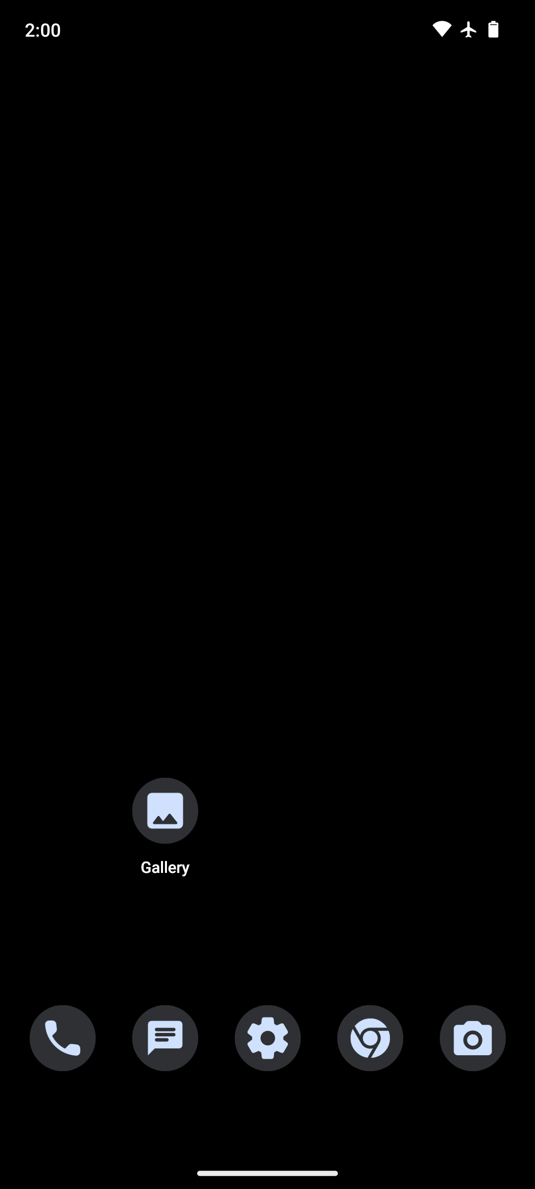 A GrapheneOS home screen — a quiet black desktop with only a handful of apps.
